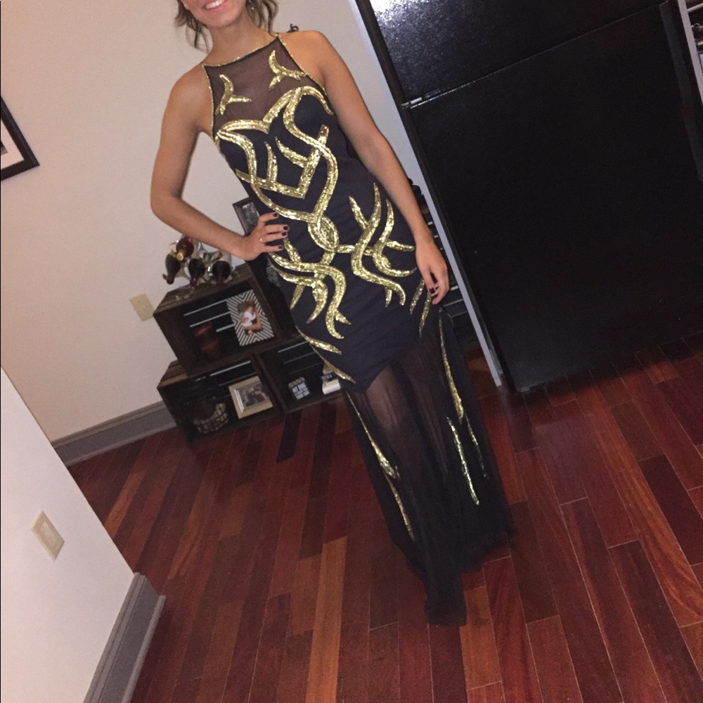 Black and gold sheer gown with gold detailing